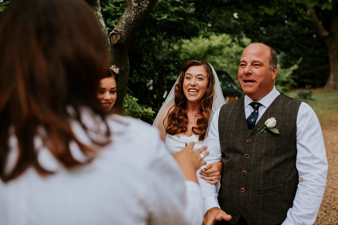 celebrant looking after bride and father